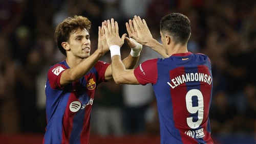 Soccer Football - LaLiga - FC Barcelona v Celta Vigo - Estadi Olimpic Lluis Companys, Barcelona, Spain - September 23, 2023 FC Barcelonas Robert Lewandowski celebrates scoring their first goal with teammate Joao Felix REUTERS/Albert Gea