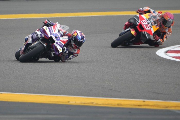 Prima Pramac Racing (Ducati) team Spanish rider Jorge Martín , FRONT, AND Repsol Honda Team Spanish rider Marc Marquez compete at the qualifying rounds during Moto GP Bharat in Greater Noida, on the outskirts of New Delhi, India Saturday, Sept. 23, 2023. (AP Photo/Manish Swarup)