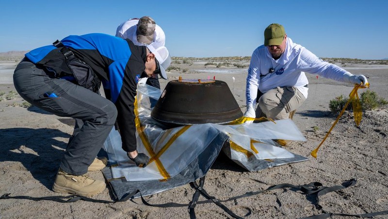 The return capsule containing a sample collected from the asteroid Bennu in October 2020 by NASA’s OSIRIS-REx spacecraft is seen shortly after touching down in the desert at the Department of Defense's Utah Test and Training Range in Dugway, Utah, U.S. September 24, 2023.  NASA/Keegan Barber/Handout via REUTERS THIS IMAGE HAS BEEN SUPPLIED BY A THIRD PARTY. MANDATORY CREDIT     TPX IMAGES OF THE DAY