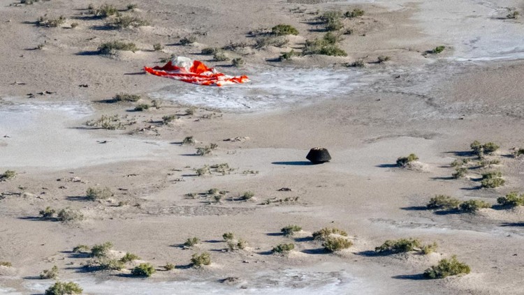 The return capsule containing a sample collected from the asteroid Bennu in October 2020 by NASA’s OSIRIS-REx spacecraft is seen shortly after touching down in the desert at the Department of Defenses Utah Test and Training Range in Dugway, Utah, U.S. September 24, 2023.  NASA/Keegan Barber/Handout via REUTERS THIS IMAGE HAS BEEN SUPPLIED BY A THIRD PARTY. MANDATORY CREDIT     TPX IMAGES OF THE DAY