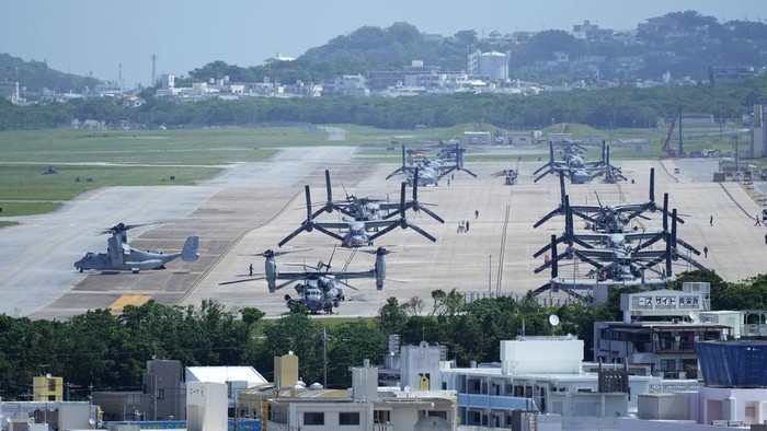 A U.S. MV-22B Osprey transport aircraft, left, taxies before taking off from the U.S. Marine Corps Air Station Futenma in Ginowan, south of Okinawa, southern Japan, Wednesday, Sept. 6, 2023. (AP Photo/Hiro Komae)