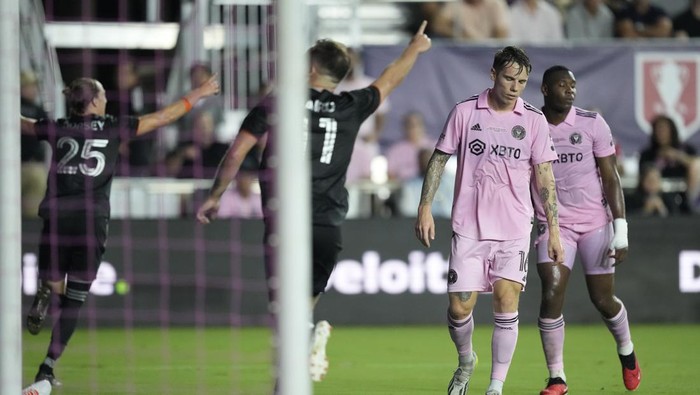 Inter Miami midfielder Robert Taylor (16) reacts as Houston Dynamo midfielder Griffin Dorsey (25) celebrates scoring his sides first goal, in the first half of their U.S. Open Cup final soccer match, Wednesday, Sept. 27, 2023, in Fort Lauderdale, Fla. (AP Photo/Rebecca Blackwell)