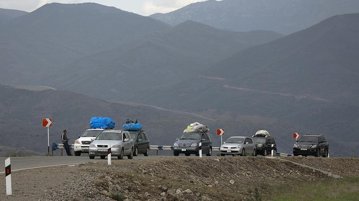 FILE - A convoy of cars of ethnic Armenians from Nagorno-Karabakh move to Kornidzor in Syunik region, Armenia, Sept. 26, 2023. Thousands of Nagorno-Karabakh residents are fleeing their homes after Azerbaijan's swift military operation to reclaim control of the breakaway region after a three-decade separatist conflict. (AP Photo/Vasily Krestyaninov, File)