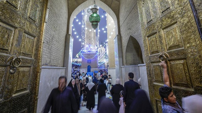 Muslims gathered in the holy Sunni shrine of Abdul-Qadir al-Gailani to mark the Prophet Mohammed's birthday in Baghdad, Iraq, Tuesday, Sept. 26, 2023. (AP Photo/Hadi Mizban)