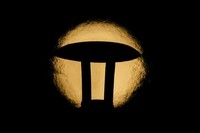 An exhaust pipe from a diesel generator spouts fumes as the September full moon, known as the Harvest Moon, rises in the background, in Beirut, Lebanon, Friday, Sept. 29, 2023. (AP Photo/Hassan Ammar)