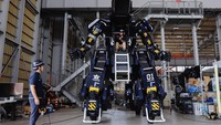 CEO Ryo Yoshida poses for a photograph with ARCHAX, a giant human-piloted robot developed by his start-up Tsubame Industries Co., in Yokohama, south of Tokyo, Japan September 27, 2023.  REUTERS/Issei Kato