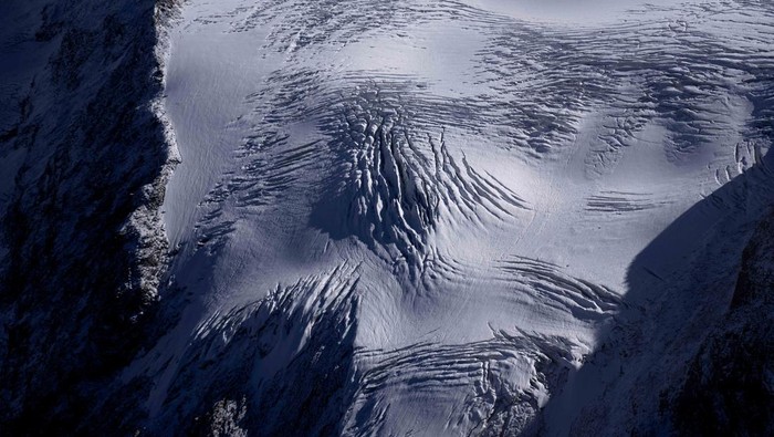 The Stubai Glacier ski area with water reservoirs for ski lifts are visible near Innsbruck, Austria, Monday, Sept. 25, 2023. (AP Photo/Matthias Schrader)