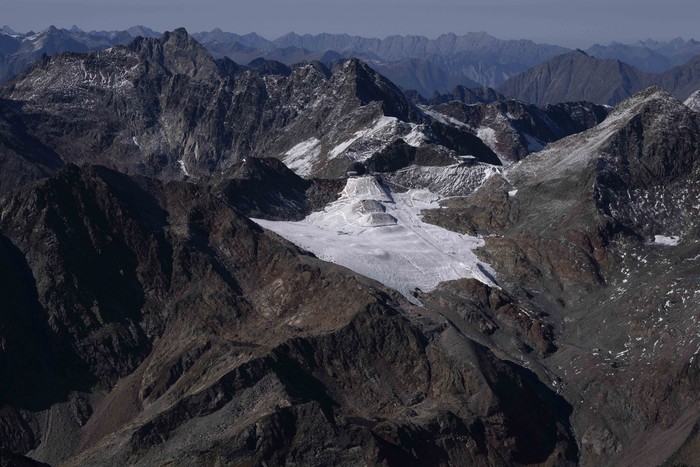 The Stubai Glacier ski area with water reservoirs for ski lifts are visible near Innsbruck, Austria, Monday, Sept. 25, 2023. (AP Photo/Matthias Schrader)
