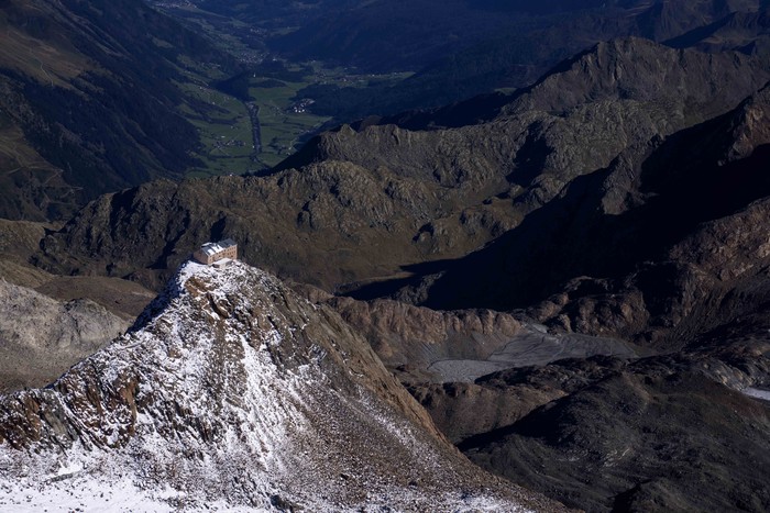 The Stubai Glacier ski area with water reservoirs for ski lifts are visible near Innsbruck, Austria, Monday, Sept. 25, 2023. (AP Photo/Matthias Schrader)