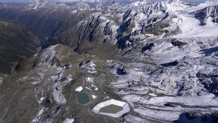 The Stubai Glacier ski area with water reservoirs for ski lifts are visible near Innsbruck, Austria, Monday, Sept. 25, 2023. (AP Photo/Matthias Schrader)