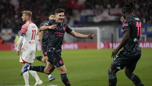 Manchester Citys Julian Alvarez celebrates after scoring his sides second goal during the Champions League group G soccer match between RB Leipzig and Manchester City in Leipzig, Germany, Wednesday, Oct. 4, 2023. (AP Photo/Matthias Schrader)