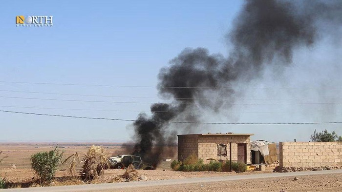 Smoke rises from a car after an alleged Turkish strike on Hasakah, Syria, October 5, 2023. North Press Agency/Handout via REUTERS