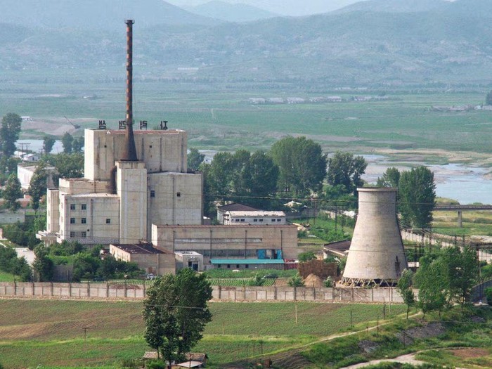 A North Korean nuclear plant is seen before demolishing a cooling tower (R) in Yongbyon, in this photo taken June 27, 2008 and released by Kyodo. North Korea is to restart the mothballed Yongbyon nuclear reactor that has been closed since 2007 in a move that could produce more plutonium for nuclear weapons as well as for domestic electricity production, its KCNA news agency said on April 2, 2013. As well as restarting the 5MW reactor at Yongbyon, the Norths only known source of plutonium for its nuclear weapons programme, KCNA said a uranium enrichment plant would also be put back into operation, a move that could give it a second path to the bomb. Picture taken June 27, 2008. Mandatory Credit. REUTERS/Kyodo