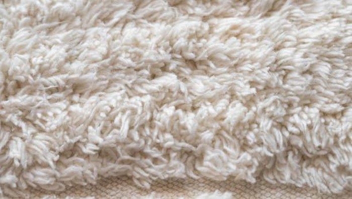 Close-up macro white doormat.