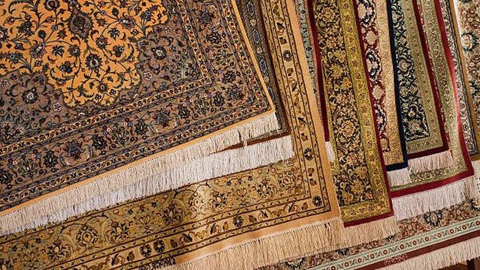 Rugs hanging up for sale in a market
