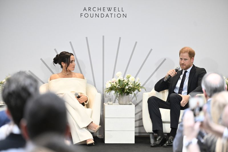Britain's Prince Harry, The Duke of Sussex, left, and Meghan, Duchess of Sussex, participate in The Archewell Foundation Parents' Summit 