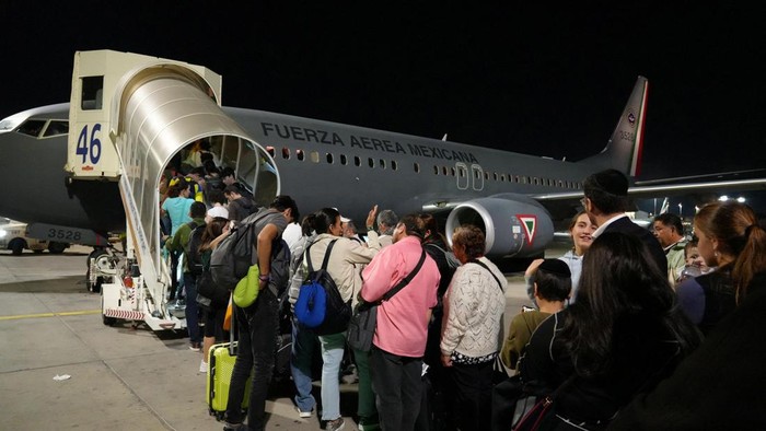 Mexicans board a plane of the Mexican Secretariat of National Defense (SEDENA) during a repatriation flight to Mexico, at Ben Gurion International Airport in Tel Aviv, Israel, in this photo distributed to Reuters on October 10, 2023. Mexican Foreign Minister office (SRE)/Handout via REUTERS ATTENTION EDITORS - THIS IMAGE WAS PROVIDED BY A THIRD PARTY. NO RESALES. NO ARCHIVES.