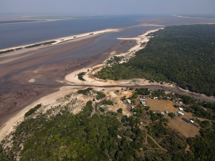 An aerial view shows the Negro River, which has been affected by drought, in front of Santa Helena do Ingles community, in Iranduba, Amazonas state Brazil, October 7, 2023. REUTERS/Bruno Kelly