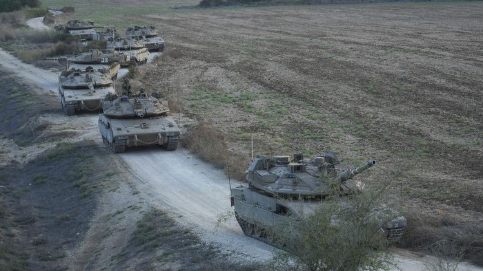 Israeli tanks move near the Israeli Gaza border, Israel, Wednesday, Oct. 11, 2023. (AP Photo/Erik Marmor)