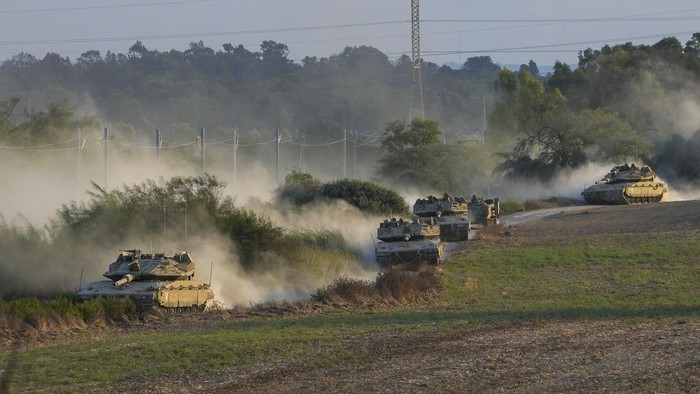 Israeli tanks move near the Israeli Gaza border, Israel, Wednesday, Oct. 11, 2023. (AP Photo/Erik Marmor)