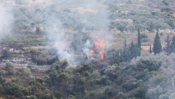 Smoke and fire are seen after Israeli shelling in the village of Dhayra, near the border with Israel, in southern Lebanon, October 11, 2023. REUTERS/Mohamed Azakir