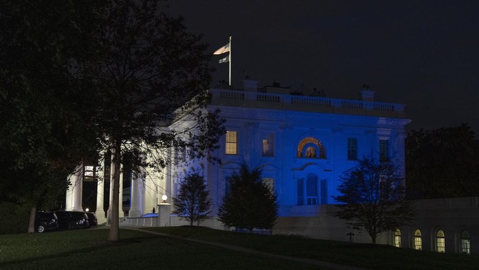 The White House is lit in blue and white, the colors of the Israeli flag, to underscore U.S. solidarity with Israel, Monday, Oct. 9, 2023, in Washington. (AP Photo/Jon Elswick)
