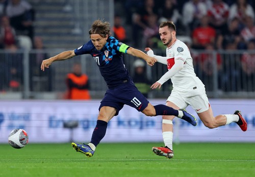 Soccer Football - Euro 2024 Qualifier - Group D - Croatia v Turkey - Opus Arena, Slavonia, Croatia - October 12, 2023 Croatias Luka Modric in action with Turkeys Kerem Akturkogluno REUTERS/Antonio Bronic