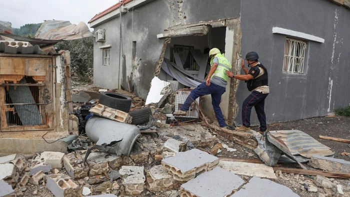 A view shows damage after Israeli shelling in the village of Dhayra, near the border with Israel, in southern Lebanon, October 11, 2023. REUTERS/Mohamed Azakir