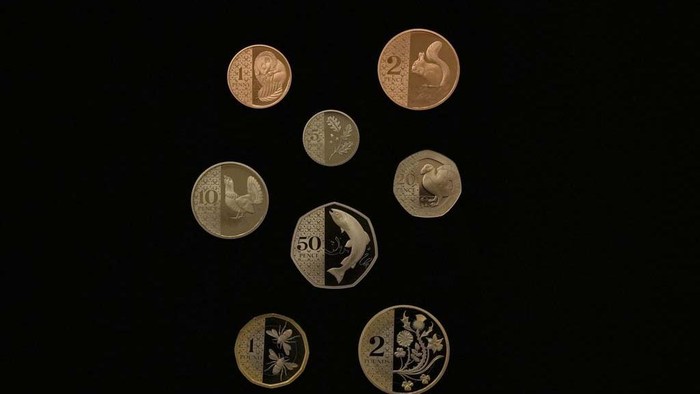The Royal Mint unveils new coins for use in the United Kingdom, they use UK flora and fauna as images on the reverse side, a detail showing the new 20 pence coin, the Puffin motif on display during a media preview in London, Thursday, Oct. 12, 2023. (AP Photo/Alastair Grant)