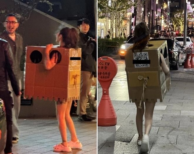 Model dewasa Korea berkeliaran telanjang memakai kardus.