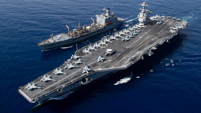 Siap Bantu Israel, Kapal Induk Terbesar Dunia Milik AS Tiba di Laut Mediterania The world?s largest aircraft carrier USS Gerald R. Ford steams alongside USNS Laramie (T-AO-203) during a fueling-at-sea in the eastern Mediterranean Sea, as a scheduled deployment in the U.S Naval Forces Europe area of operations, deployed by U.S. Sixth Fleet to defend U.S, allied, and partners interests, in this photo taken on October, 11, 2023 and released by U.S. Navy on October 14, 2023. U.S Naval Forces Central Command / U.S. 6th Fleet / Handout via REUTERS ATTENTION EDITORS - THIS PICTURE WAS PROVIDED BY A THIRD PARTY