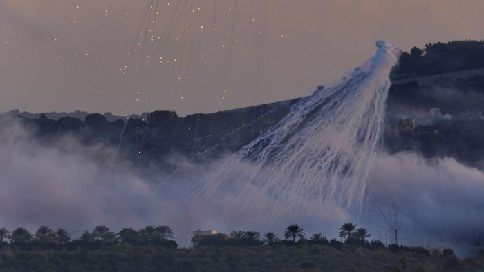Smoke rises from Israeli artillery shelling in Dahaira, a Lebanese border village with Israel, south Lebanon, Monday, Oct. 16, 2023. Lebanons militant Hezbollah group says its fighters have targeted an Israeli position along the border directly hitting a Merkava tank. (AP Photo/Hussein Malla)