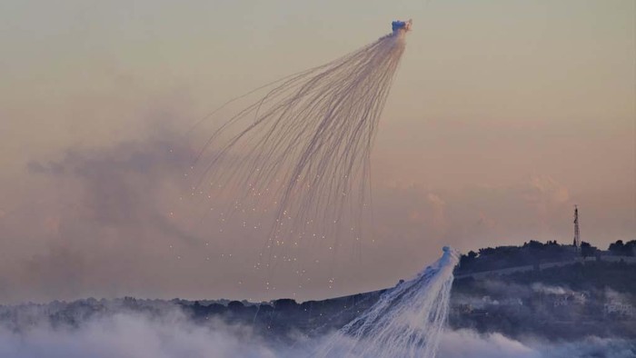 Smoke rises from Israeli artillery shelling in Dahaira, a Lebanese border village with Israel, south Lebanon, Monday, Oct. 16, 2023. Lebanon's militant Hezbollah group says its fighters have targeted an Israeli position along the border directly hitting a Merkava tank. (AP Photo/Hussein Malla)