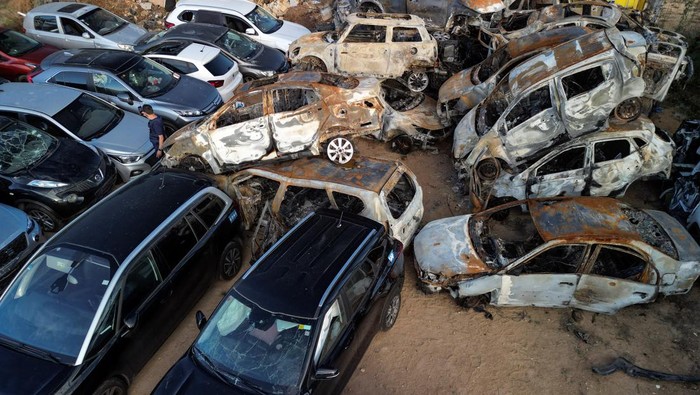 An aerial view shows damaged vehicles that were destroyed in the ongoing conflict between Israel and the Palestinian Islamist group Hamas, are seen after being collected in Sderot, southern Israel, October 17, 2023. REUTERS/Amir Cohen