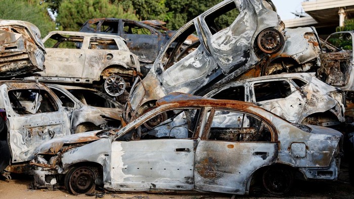 An aerial view shows damaged vehicles that were destroyed in the ongoing conflict between Israel and the Palestinian Islamist group Hamas, are seen after being collected in Sderot, southern Israel, October 17, 2023. REUTERS/Amir Cohen