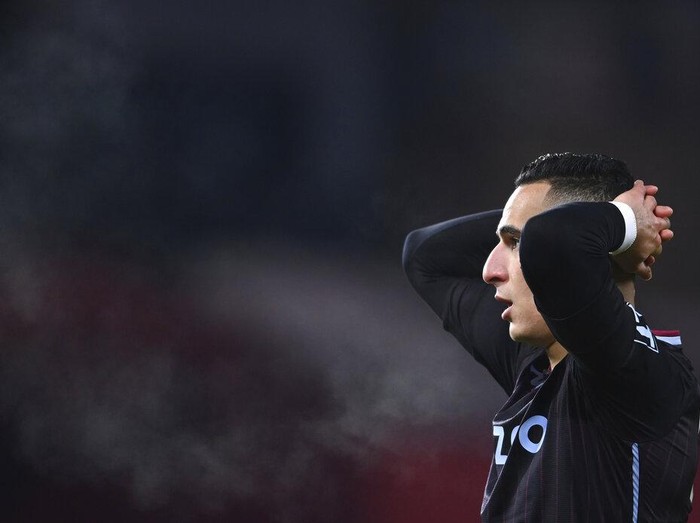 Aston Villas Anwar El Ghazi reacts after teammate Aston Villas Ollie Watkins nearly scores a gaol during the English Premier League soccer match between Manchester United and Aston Villa at Old Trafford in Manchester, England, Friday, Jan. 1, 2021. (Lawrence Griffiths/ Pool via AP)