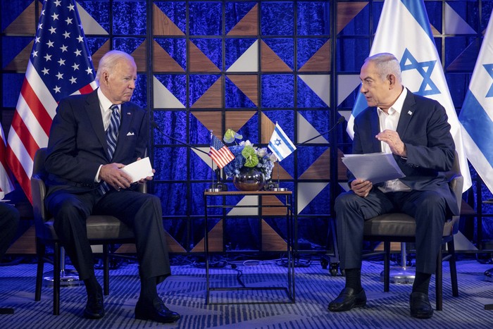 U.S. President Joe Biden, left, meets with Israeli Prime Minister Benjamin Netanyahu, right, to discuss the the war between Israel and Hamas, in Tel Aviv, Israel, Wednesday, Oct. 18, 2023. (Miriam Alster/Pool Photo via AP)