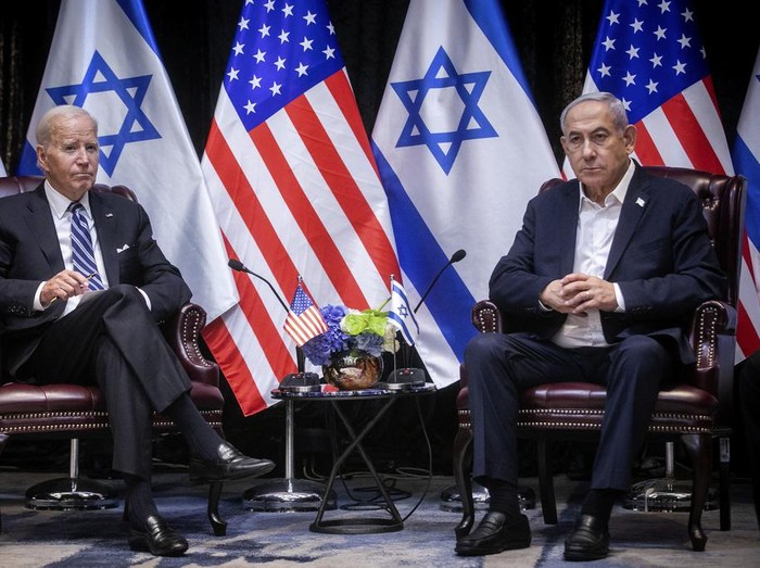 U.S. President Joe Biden, left, pauses during a meeting with Israeli Prime Minister Benjamin Netanyahu, right, in Tel Aviv, Israel, Wednesday, Oct. 18, 2023. (Miriam Alster/Pool Photo via AP)