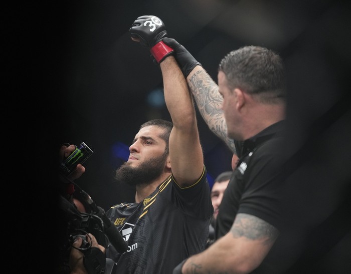 Russias Islam Makhachev, left, is declared winner in his Lightweight bout against Australias Alexander Volkanovski during UFC 294, at the Ethihad Arena in Abu Dhabi, United Arab Emirates, Saturday, Oct. 21, 2023. (AP Photo/Kamran Jebreili)