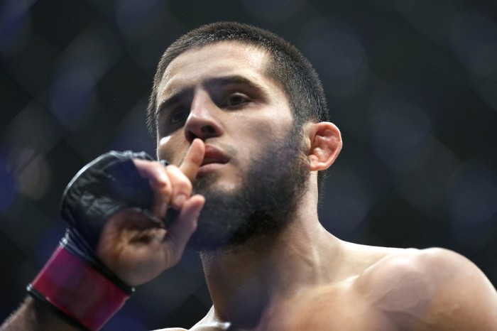 Islam Makhachev of Russia celebrates after he beats Alex Volkanovski of Australia in the UFC lightweight championship fight during UFC 294, at the Ethihad Arena in Abu Dhabi, United Arab Emirates, Saturday, Oct. 21, 2023. (AP Photo/Kamran Jebreili)