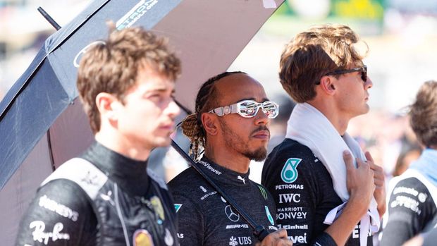 Oct 22, 2023; Austin, Texas, USA;  From left, Charles Leclerc of Ferrari, Lewis Hamilton and Mercedes teammate George Russell before the start of the Formula 1 United States Grand Prix at Circuit of the Americas. Mandatory Credit: Erich Schlegel-USA TODAY Sports