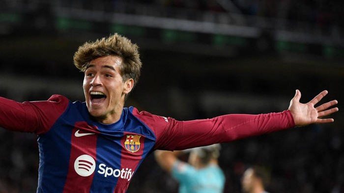 Barcelonas Spanish forward #38 Marc Guiu celebrates after scoring his teams first goal during the Spanish league football match between FC Barcelona and Athletic Club Bilbao at the Estadi Olimpic Lluis Companys in Barcelona on October 22, 2023. (Photo by Josep LAGO / AFP)