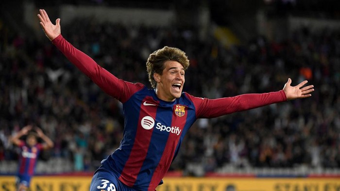 Barcelonas Spanish forward #38 Marc Guiu celebrates after scoring his teams first goal during the Spanish league football match between FC Barcelona and Athletic Club Bilbao at the Estadi Olimpic Lluis Companys in Barcelona on October 22, 2023. (Photo by Josep LAGO / AFP)