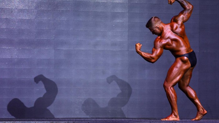 Male bodybuilders compete on stage during the IBFA British Finals Night of Champions contest at the Federation Brewery in Gateshead, Britain, October 22, 2023. REUTERS/Lee Smith
