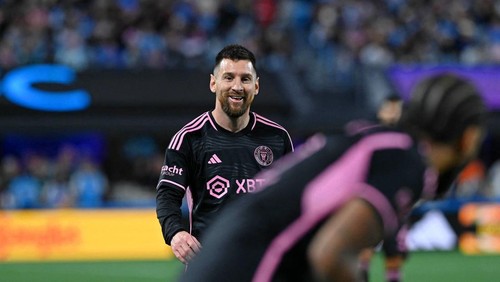 Oct 21, 2023; Charlotte, North Carolina, USA; Inter Miami CF forward Lionel Messi (10) smiles while talking to defender DeAndre Yedlin (2) during the first half against Charlotte FC at Bank of America Stadium. Mandatory Credit: Griffin Zetterberg-USA TODAY Sports