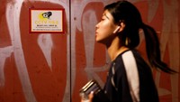 People walk through an alley in Itaewon where the Halloween crowd crush occurred last year, in Seoul, South Korea, October 23, 2023. REUTERS/Kim Soo-hyeon
