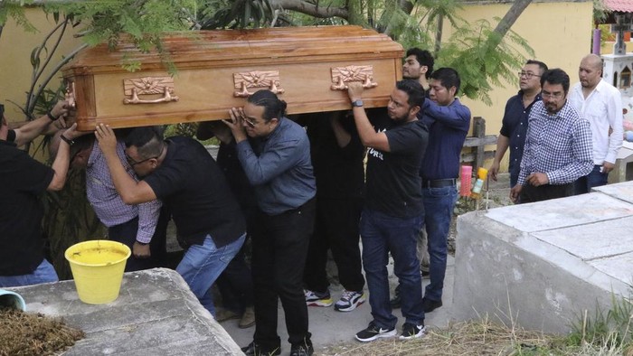 Relatives of the academic and community leader Rigoberto Acosta González carry his casket during his funeral service in Chilpancingo, Guerrero state, Mexico, Tuesday, Oct. 24, 2023. Acosta González was shot to death in Chilpancingo the previous day, according to authorities. (AP Photo/Alejandrino Gonzalez)