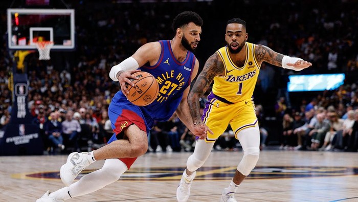 Oct 24, 2023; Denver, Colorado, USA; Denver Nuggets guard Jamal Murray (27) controls the ball as Los Angeles Lakers guard DAngelo Russell (1) guards in the second quarter at Ball Arena. Mandatory Credit: Isaiah J. Downing-USA TODAY Sports