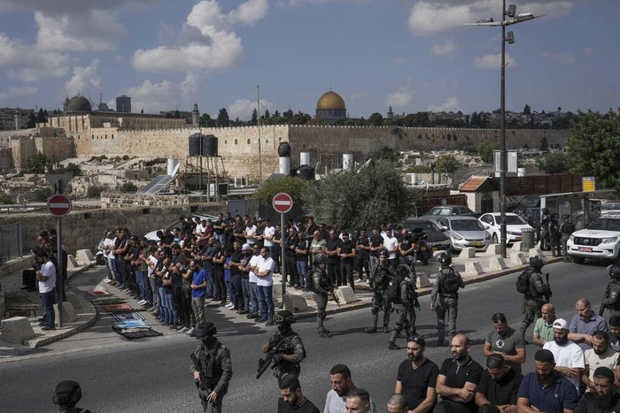 Jews pray at the Western Wall, beside the Temple Mount, known to Muslims as the Noble Sanctuary, or the Al-Aqsa Mosque compound, in the Old City of Jerusalem, Monday, Oct. 16, 2023. (AP Photo/Jon Gambrell)