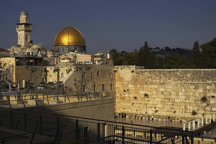 Jews pray at the Western Wall, beside the Temple Mount, known to Muslims as the Noble Sanctuary, or the Al-Aqsa Mosque compound, in the Old City of Jerusalem, Monday, Oct. 16, 2023. (AP Photo/Jon Gambrell)